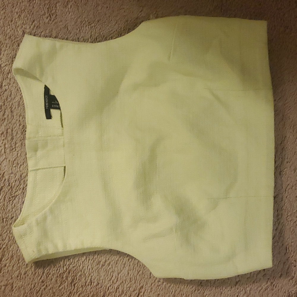 Yellow crop top with buttons on the back.